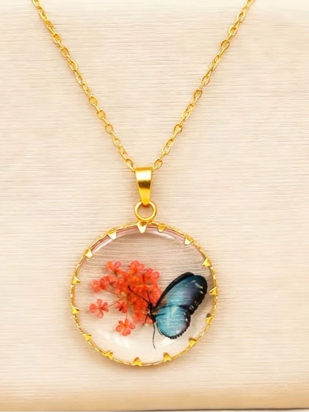 Gold Necklace with Pressed Blue Butterfly and Orange Flower Pendant